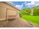 Patio space with a porch swing, surrounded by greenery, ideal for relaxation at 3537 Woodglen Way, Anderson, IN 46011