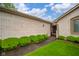 Brick home with a walkway lined by green shrubbery, leading to an inviting entrance at 3537 Woodglen Way, Anderson, IN 46011
