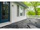 Back porch featuring a glass door that leads into the house, a window, and a white railing at 4130 N Meridian St, Indianapolis, IN 46208