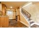 Finished basement features a kitchenette with custom cabinets, and stairs to the main floor at 4130 N Meridian St, Indianapolis, IN 46208