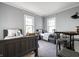 Shared bedroom boasts two beds, two windows, and a versatile study area at 4130 N Meridian St, Indianapolis, IN 46208