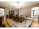 Elegant dining room features hardwood floors, a chandelier, and an antique china cabinet at 4130 N Meridian St, Indianapolis, IN 46208