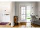 Entryway with hardwood floors, white trim, a view to the porch, and neutral wall color at 4130 N Meridian St, Indianapolis, IN 46208