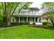 Charming two-story home featuring a welcoming front porch and a well-maintained front yard at 4130 N Meridian St, Indianapolis, IN 46208