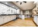 Kitchen with stainless steel dishwasher, hardwood floors and a view to the dining area at 4130 N Meridian St, Indianapolis, IN 46208