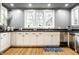 Charming kitchen with white cabinets, stainless steel dishwasher, and a view from the window at 4130 N Meridian St, Indianapolis, IN 46208