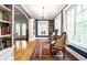 Charming living room featuring a chandelier, hardwood floors, a rug, and an arched doorway at 4130 N Meridian St, Indianapolis, IN 46208