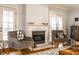 Comfortable seating area with a fireplace, perfect for relaxing and entertaining guests at 4130 N Meridian St, Indianapolis, IN 46208