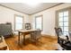 Bright and airy office with hardwood floors, natural light, and comfortable seating at 4130 N Meridian St, Indianapolis, IN 46208