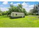Backyard shed is perfect for storage with its window, door, and two-tone paint at 4197 E 250 S, Franklin, IN 46131