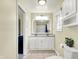Bright bathroom with updated fixtures, a large mirror, and plenty of cabinet space at 4197 E 250 S, Franklin, IN 46131