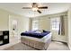 Inviting bedroom with neutral walls, a ceiling fan and two windows providing natural light at 4197 E 250 S, Franklin, IN 46131