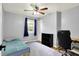 This cozy bedroom has great lighting and a view to the backyard at 4197 E 250 S, Franklin, IN 46131