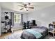 This bedroom features a ceiling fan and natural light with a window view at 4197 E 250 S, Franklin, IN 46131