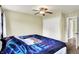 Comfortable bedroom with closet space, neutral walls, and a ceiling fan at 4197 E 250 S, Franklin, IN 46131