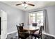 A dining area with a round table and chairs featuring a ceiling fan and large window at 4197 E 250 S, Franklin, IN 46131