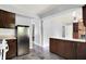 Open concept kitchen featuring a modern refrigerator and view of adjacent rooms at 4197 E 250 S, Franklin, IN 46131