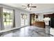 Kitchen featuring a patio door, light-filled windows, and brown wooden cabinetry at 4197 E 250 S, Franklin, IN 46131