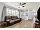 Comfortable living room with a large window for lots of natural light and a ceiling fan at 4197 E 250 S, Franklin, IN 46131