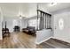 Open-concept living room with hardwood flooring, neutral walls, and a ceiling fan at 4197 E 250 S, Franklin, IN 46131