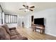 Spacious living room featuring durable wood floors, neutral paint, and a ceiling fan at 4197 E 250 S, Franklin, IN 46131