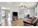 Bright living room with hardwood flooring leading to the dining room and a view of backyard at 4197 E 250 S, Franklin, IN 46131