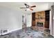 Spacious living room features a brick fireplace with custom shelves and unique tile floors at 4197 E 250 S, Franklin, IN 46131