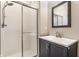 Modern bathroom vanity with a glass-enclosed shower at 4332 Heyward Pl, Indianapolis, IN 46250
