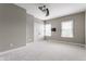 Comfortable bedroom with plush carpet, ceiling fan and neutral walls at 4332 Heyward Pl, Indianapolis, IN 46250