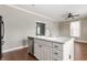 Spacious kitchen island provides ample countertop space, with hardwood floors and a view of the living area at 4332 Heyward Pl, Indianapolis, IN 46250