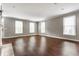 Bright and airy living room with hardwood floors and large windows at 4332 Heyward Pl, Indianapolis, IN 46250