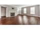 Spacious living room features a fireplace, hardwood floors, and plenty of natural light at 4332 Heyward Pl, Indianapolis, IN 46250