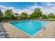 Community pool with lounge chairs and lush landscaping, perfect for relaxing summer days at 4332 Heyward Pl, Indianapolis, IN 46250