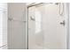 Bathroom shower with glass doors and white tiled walls at 4332 Heyward Pl, Indianapolis, IN 46250