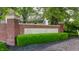 Community sign featuring 'Sycamore Springs' with beautiful brickwork and well-maintained landscaping at 4332 Heyward Pl, Indianapolis, IN 46250