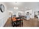Dining area offers hardwood floors with an open view into a bright kitchen at 5020 Eldon Dr, Noblesville, IN 46062