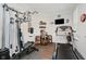 Home gym with various workout equipment, including a treadmill and weight machine, for convenient fitness routines at 5020 Eldon Dr, Noblesville, IN 46062