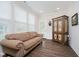 Cozy living room with hardwood floors, neutral paint and plenty of natural light at 5020 Eldon Dr, Noblesville, IN 46062