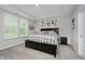 Spacious main bedroom with large windows, tray ceiling and modern decor at 5020 Eldon Dr, Noblesville, IN 46062