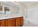 The bathroom has a double vanity, large mirror, and a shower-tub combination at 5083 Emmert Dr, Indianapolis, IN 46221