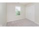 Bedroom featuring a window, plush carpet, and a double-door closet for ample storage at 5083 Emmert Dr, Indianapolis, IN 46221