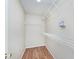 Walk-in closet includes laminate floors and wire shelving for efficient storage at 5083 Emmert Dr, Indianapolis, IN 46221