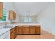 Classic kitchen featuring wooden cabinets, laminate countertops, and an undermount stainless sink at 5083 Emmert Dr, Indianapolis, IN 46221