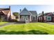 Charming brick home with a cozy front porch and a well-manicured lawn at 5428 E 10Th St, Indianapolis, IN 46219