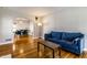 Spacious living room with hardwood floors leading to an adjacent dining area at 5428 E 10Th St, Indianapolis, IN 46219