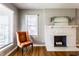 Cozy living room featuring hardwood floors and a classic fireplace at 5428 E 10Th St, Indianapolis, IN 46219