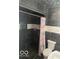 Well-lit bathroom with dark-tiled shower and mosaic accents at 5802 Bertha St, Indianapolis, IN 46241