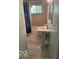 Neutral bathroom with pedestal sink and a combination tub and shower at 5802 Bertha St, Indianapolis, IN 46241