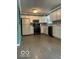 Efficient kitchen featuring white cabinetry and modern black appliances at 5802 Bertha St, Indianapolis, IN 46241