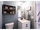 Small bathroom with a vanity, mirror, toilet, and decorative coastal-themed decor at 5824 W Commonview Dr, McCordsville, IN 46055